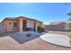 Expansive backyard featuring desert landscaping and a covered patio for outdoor enjoyment at 18474 N Celis St, Maricopa, AZ 85138
