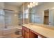 Bright bathroom featuring a shower/tub combo and a large vanity at 18474 N Celis St, Maricopa, AZ 85138