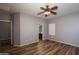The bedroom features wood-look floors and a ceiling fan at 18474 N Celis St, Maricopa, AZ 85138