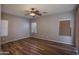 Bedroom featuring three windows and a ceiling fan at 18474 N Celis St, Maricopa, AZ 85138