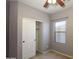 Bedroom with slider-door closet, neutral walls, and window at 18474 N Celis St, Maricopa, AZ 85138