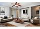 Inviting living room features neutral colors and comfortable seating at 18474 N Celis St, Maricopa, AZ 85138