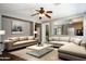 Open living room with neutral palette, recessed lighting and natural light at 18474 N Celis St, Maricopa, AZ 85138