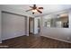 Bright, open living room with laminate flooring and views into kitchen at 18474 N Celis St, Maricopa, AZ 85138