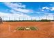 Exterior shot of a baseball field with manicured clay, green grass, and fencing at 2206 S Ellsworth Rd # 157B, Mesa, AZ 85209