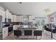 Spacious kitchen featuring stainless steel appliances, a central island, and casual bar seating at 2206 S Ellsworth Rd # 157B, Mesa, AZ 85209