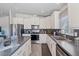 Well-appointed kitchen featuring stainless steel appliances, sleek countertops, and modern finishes at 2206 S Ellsworth Rd # 157B, Mesa, AZ 85209