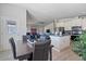 Open-concept kitchen featuring stainless appliances, center island, and seamless flow to living area at 2206 S Ellsworth Rd # 157B, Mesa, AZ 85209