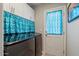 Bright laundry room with front-load washer and dryer at 2206 S Ellsworth Rd # 157B, Mesa, AZ 85209