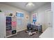 Functional home office with a workspace, storage, and lots of natural light at 2206 S Ellsworth Rd # 157B, Mesa, AZ 85209