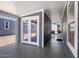 Covered patio with double glass doors leading to the home at 2206 S Ellsworth Rd # 157B, Mesa, AZ 85209