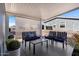 Cozy covered patio with comfortable furniture and a sun shade at 2206 S Ellsworth Rd # 157B, Mesa, AZ 85209