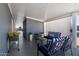 Relaxing covered patio with furniture, potted plants, and decor at 2206 S Ellsworth Rd # 157B, Mesa, AZ 85209