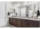 Bathroom with double vanity, granite countertop, and tile floors at 26774 W Piute Ave, Buckeye, AZ 85396