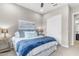 Bright bedroom with a large bed, stylish blue accents, and ample closet space at 26774 W Piute Ave, Buckeye, AZ 85396