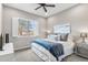 Cozy bedroom with a comfortable bed and a window overlooking the neighborhood at 26774 W Piute Ave, Buckeye, AZ 85396