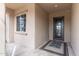 Cozy front porch with a decorative door and window at 26774 W Piute Ave, Buckeye, AZ 85396