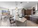 Gourmet kitchen with a large center island, stainless steel appliances, and pendant lighting at 26774 W Piute Ave, Buckeye, AZ 85396