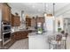 Well-equipped kitchen with a center island, stainless steel appliances, and granite countertops at 26774 W Piute Ave, Buckeye, AZ 85396