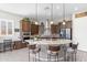Gourmet kitchen featuring a large island with bar seating and pendant lighting at 26774 W Piute Ave, Buckeye, AZ 85396
