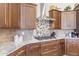 Gourmet kitchen featuring granite countertops, stainless steel appliances, and mosaic backsplash at 26774 W Piute Ave, Buckeye, AZ 85396