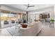 Open living room with access to the backyard patio and seamless flow to the kitchen at 26774 W Piute Ave, Buckeye, AZ 85396