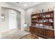 Office featuring a large decorative cabinet for display and storage at 26774 W Piute Ave, Buckeye, AZ 85396
