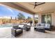 Relaxing covered patio with comfortable furniture and views of the pool at 26774 W Piute Ave, Buckeye, AZ 85396
