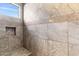 Tiled shower featuring a built-in bench and niche at 26774 W Piute Ave, Buckeye, AZ 85396