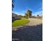 Spacious backyard featuring artificial turf, gravel landscaping and mature trees at 32071 N Chestnut Trl, San Tan Valley, AZ 85143