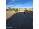 Spacious desert backyard featuring gravel landscaping, cacti, and a sturdy fence at 32071 N Chestnut Trl, San Tan Valley, AZ 85143