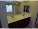 Bathroom with double sink vanity and a separate tiled glass block shower and bathtub at 32071 N Chestnut Trl, San Tan Valley, AZ 85143