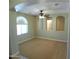 Spacious bedroom featuring a ceiling fan, recessed lighting, and arched window for abundant natural light at 32071 N Chestnut Trl, San Tan Valley, AZ 85143