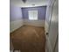 Bedroom with purple paint and wainscotting at 32071 N Chestnut Trl, San Tan Valley, AZ 85143