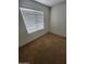 A bedroom featuring a window with white blinds at 32071 N Chestnut Trl, San Tan Valley, AZ 85143