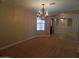 Dining area with a decorative chandelier and arched entryway, perfect for entertaining at 32071 N Chestnut Trl, San Tan Valley, AZ 85143