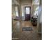 Inviting foyer featuring decorative tile flooring, natural light, and a 'Welcome to the Downers' doormat at 32071 N Chestnut Trl, San Tan Valley, AZ 85143