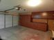 Well-lit garage with cabinets for organized storage and functional doors for vehicles at 32071 N Chestnut Trl, San Tan Valley, AZ 85143