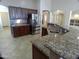 Well-equipped kitchen with granite countertops, stainless steel appliances, and ample cabinet space at 32071 N Chestnut Trl, San Tan Valley, AZ 85143