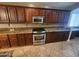 The kitchen boasts stainless steel appliances, granite countertops and rich wood cabinetry at 32071 N Chestnut Trl, San Tan Valley, AZ 85143