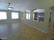 Expansive living room featuring recessed lighting, tile floors, and seamless access to the kitchen at 32071 N Chestnut Trl, San Tan Valley, AZ 85143