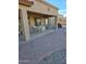 Covered patio showing neutral-colored table and chairs plus a swing at 32071 N Chestnut Trl, San Tan Valley, AZ 85143