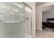 Bathroom boasting a glass enclosed shower, bench, and towel rack at 3530 N 310Th Dr, Buckeye, AZ 85396