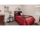 Cozy bedroom featuring a comfortable bed, a decorative quilt and a side table with a lamp at 3530 N 310Th Dr, Buckeye, AZ 85396