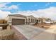 Charming single-story home featuring a two-car garage and attractive desert landscaping at 3530 N 310Th Dr, Buckeye, AZ 85396