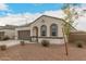Charming single-story home featuring a two-car garage and attractive desert landscaping at 3530 N 310Th Dr, Buckeye, AZ 85396