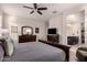 Large bedroom showcasing a king size bed, ceiling fan, and Primary bath entrance at 3530 N 310Th Dr, Buckeye, AZ 85396