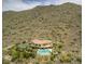 Luxury hillside home featuring a pool, desert landscape, and tennis court at 36879 N 38Th St, Cave Creek, AZ 85331