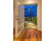 Open door displaying desert landscape with native plants and a stone pathway at 36879 N 38Th St, Cave Creek, AZ 85331