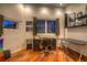 Home office with hardwood floors, a dark wooden desk, and a window for natural light at 36879 N 38Th St, Cave Creek, AZ 85331